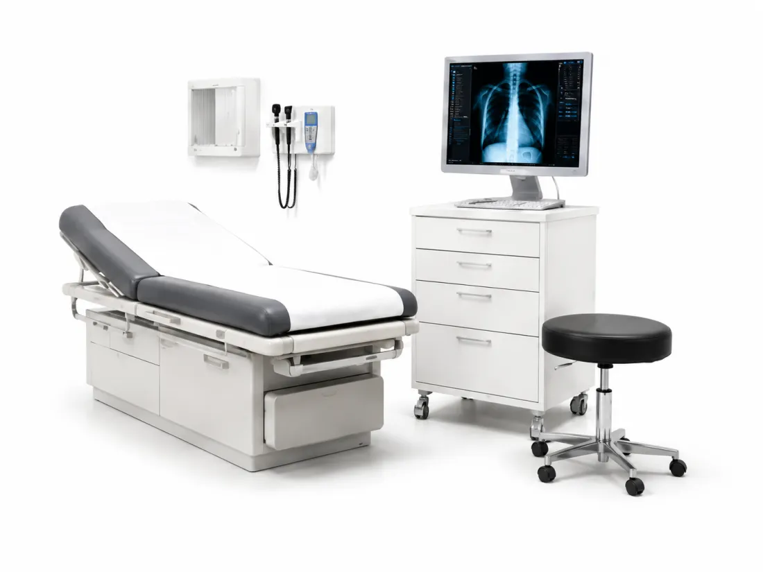 A clinical exam room with an examination table, diagnostic wall unit, and a chest radiograph on a monitor